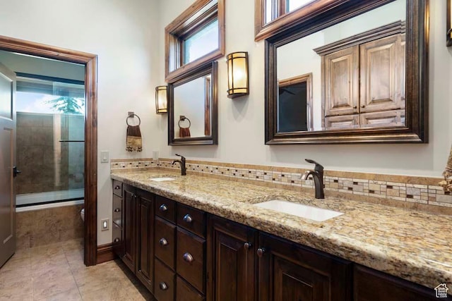 10575 S Alexander Park Ln, South Jordan, UT 84095 - full bathroom featuring a sink, double vanity, tile patterned flooring, and enclosed tub / shower combo