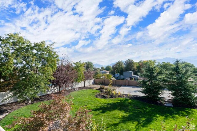10575 S Alexander Park Ln, South Jordan, UT 84095 - view of yard with a patio area, a fenced backyard, and a mountain view
