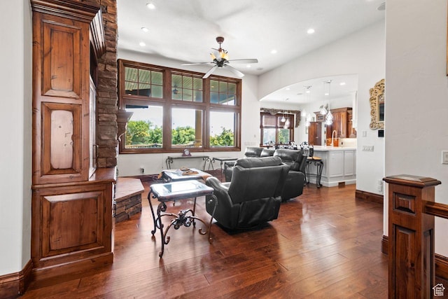 10575 S Alexander Park Ln, South Jordan, UT 84095 - living room with dark wood-style flooring, arched walkways, ceiling fan, and recessed lighting