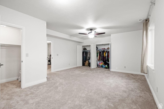 10575 S Alexander Park Ln, South Jordan, UT 84095 - unfurnished bedroom with baseboards, ceiling fan, and light colored carpet
