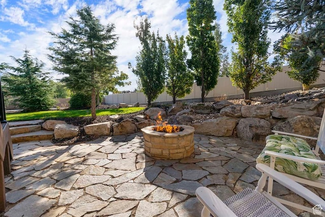 10575 S Alexander Park Ln, South Jordan, UT 84095 - view of patio with a fenced backyard and an outdoor fire pit