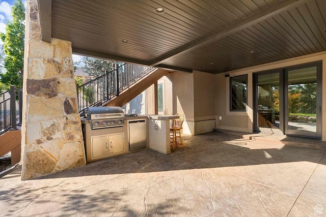 10575 S Alexander Park Ln, South Jordan, UT 84095 - view of patio / terrace with a grill, stairway, and exterior kitchen