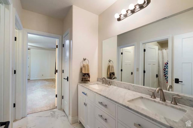10575 S Alexander Park Ln, South Jordan, UT 84095 - full bathroom with a sink, baseboards, double vanity, and marble finish floor