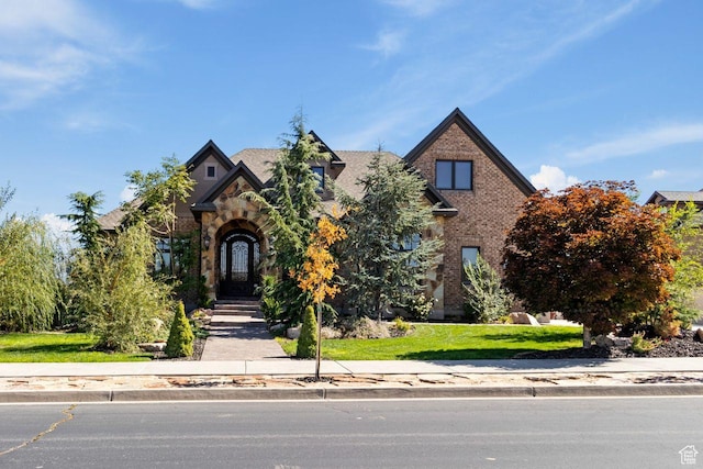 10575 S Alexander Park Ln, South Jordan, UT 84095 - view of front facade featuring stone siding and brick siding