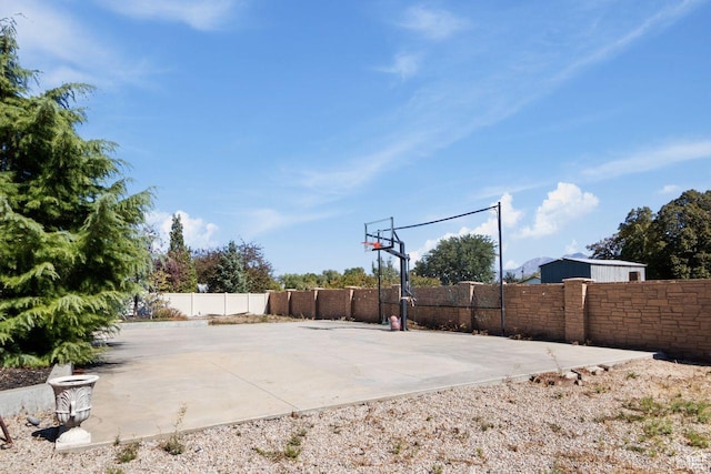 10575 S Alexander Park Ln, South Jordan, UT 84095 - view of basketball court featuring basketball court and fence