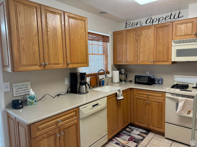 2480 W 450 S Unit 5, Springville, UT 84663 - kitchen with light countertops, a sink, brown cabinetry, and white appliances