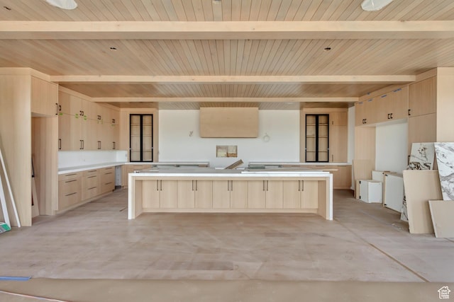 7165 Painted Valley Pass Unit 54, Park City, UT 84098 - kitchen featuring light brown cabinetry, a large island, modern cabinets, wooden ceiling, and beam ceiling