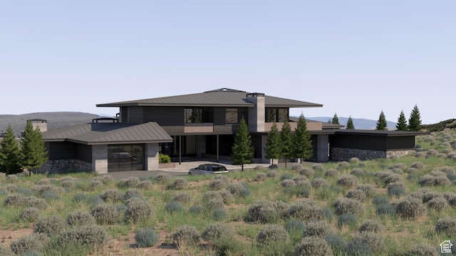7165 Painted Valley Pass Unit 54, Park City, UT 84098 - rear view of property with stone siding, a standing seam roof, and metal roof