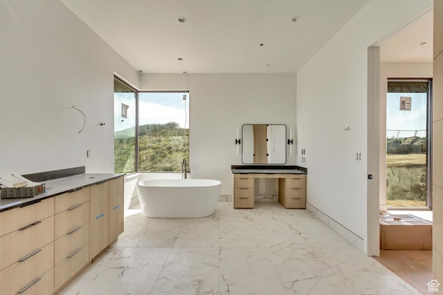 7165 Painted Valley Pass Unit 54, Park City, UT 84098 - full bathroom with a freestanding tub, marble finish floor, and vanity