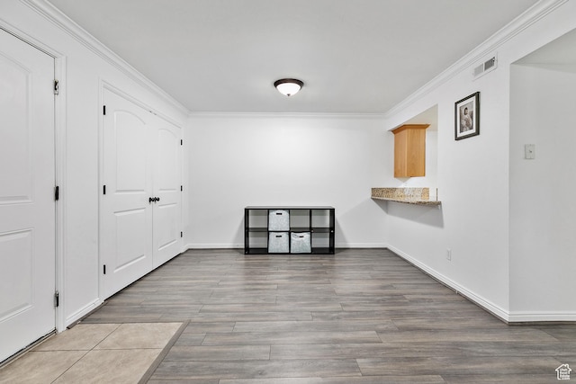5760 S 900 E Unit 3, Murray, UT 84121 - unfurnished dining area featuring baseboards, visible vents, wood finished floors, and ornamental molding