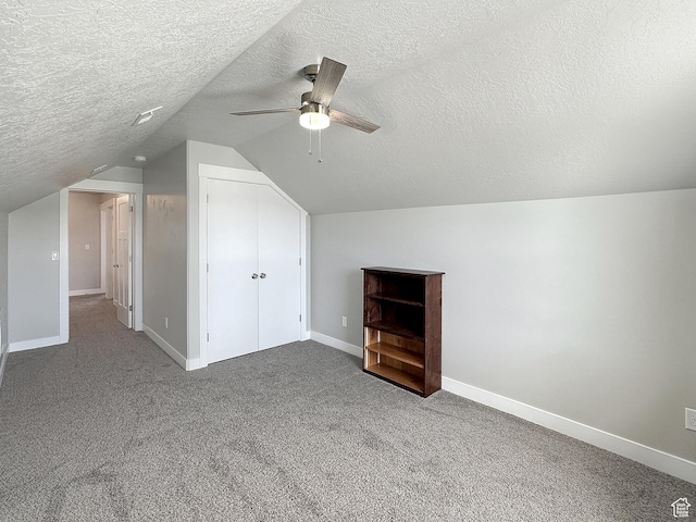 2142 W 3100 S, West Haven, UT 84401 - bonus room featuring vaulted ceiling, baseboards, a textured ceiling, carpet floors, and ceiling fan