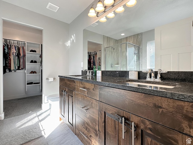2142 W 3100 S, West Haven, UT 84401 - full bath featuring visible vents, a shower stall, double vanity, a sink, and a walk in closet