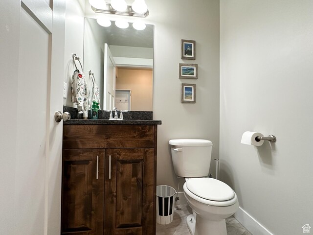 2142 W 3100 S, West Haven, UT 84401 - half bath featuring marble finish floor, baseboards, toilet, and vanity