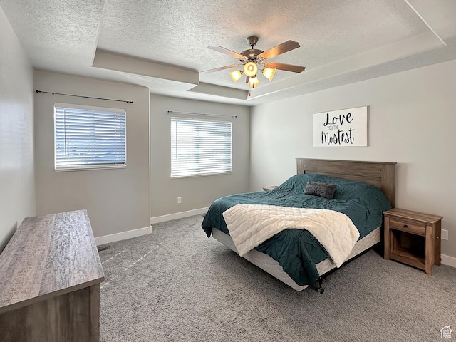 2142 W 3100 S, West Haven, UT 84401 - carpeted bedroom featuring a tray ceiling, baseboards, a ceiling fan, and a textured ceiling