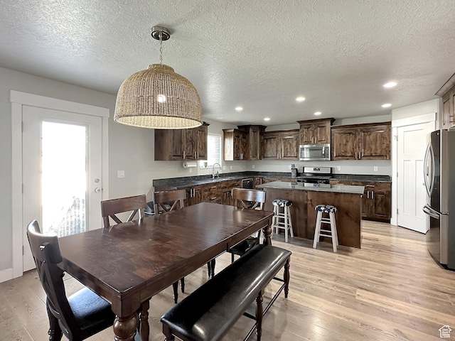 2142 W 3100 S, West Haven, UT 84401 - dining area featuring a textured ceiling, light wood finished floors, and recessed lighting