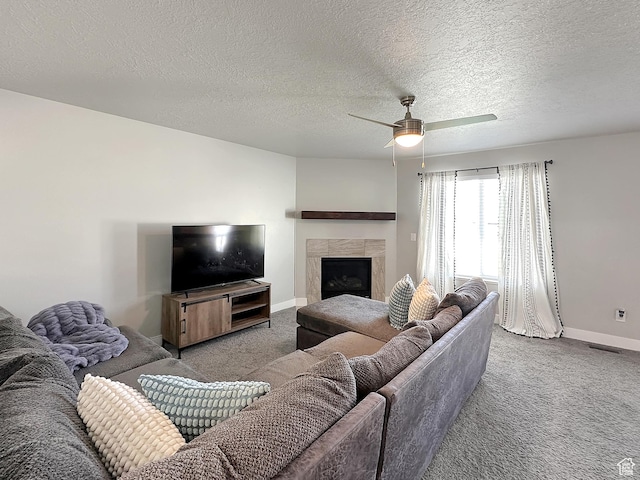 2142 W 3100 S, West Haven, UT 84401 - carpeted living room featuring a ceiling fan, a fireplace, a textured ceiling, baseboards, and visible vents