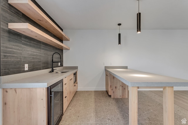 713 E 1500 N Unit 19, Orem, UT 84097 - kitchen featuring pendant lighting, wine cooler, sink, decorative backsplash, and light brown cabinetry