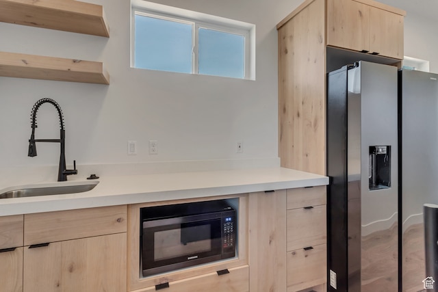 713 E 1500 N Unit 19, Orem, UT 84097 - kitchen with stainless steel refrigerator with ice dispenser, black microwave, sink, and light brown cabinets