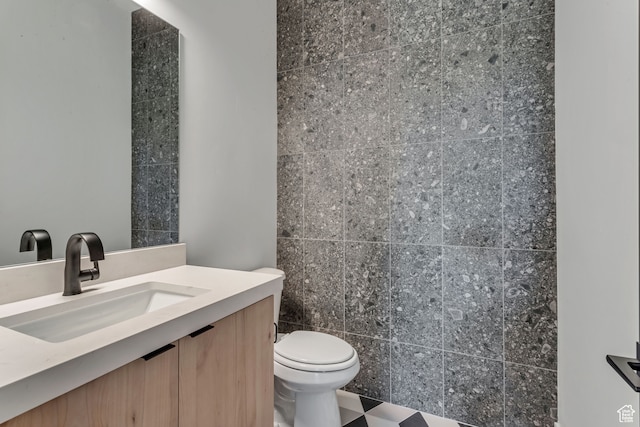 713 E 1500 N Unit 19, Orem, UT 84097 - bathroom with tile walls, vanity, and toilet