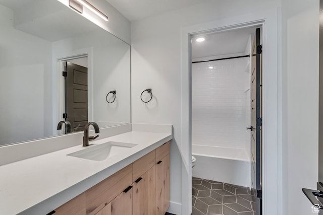 713 E 1500 N Unit 19, Orem, UT 84097 - full bathroom featuring tiled shower / bath, vanity, toilet, and tile patterned floors