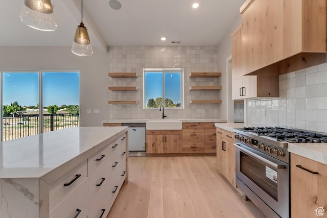 kitchen with a sink, open shelves, light brown cabinetry, and high end range