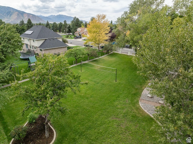 birds eye view of property with a mountain view