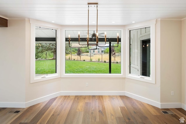 715 E 1700 N, Mapleton, UT 84664 - unfurnished dining area with baseboards, a chandelier, and wood finished floors
