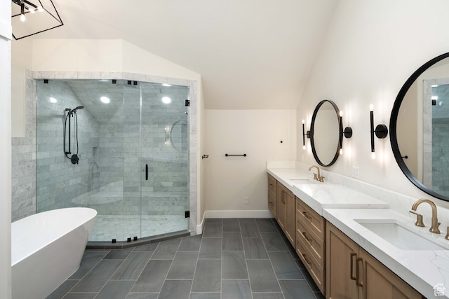 bathroom with shower with separate bathtub, vaulted ceiling, and vanity
