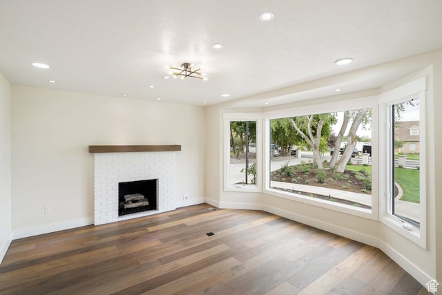 715 E 1700 N, Mapleton, UT 84664 - unfurnished living room featuring wood finished floors, recessed lighting, baseboards, and a fireplace