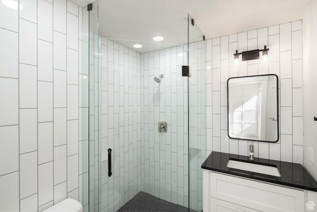 715 E 1700 N, Mapleton, UT 84664 - bathroom featuring a stall shower, vanity, toilet, tile walls, and recessed lighting