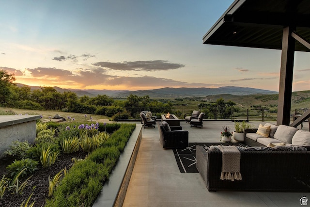 27 Normans Way, Park City, UT 84060 - patio terrace at dusk featuring an outdoor living space, a mountain view, and a patio area