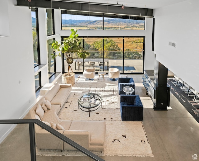 27 Normans Way, Park City, UT 84060 - living area featuring a towering ceiling, a mountain view, and floor to ceiling windows