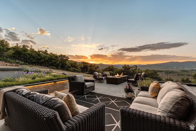 27 Normans Way, Park City, UT 84060 - patio terrace at dusk with an outdoor living space with a fire pit, a patio, and a mountain view