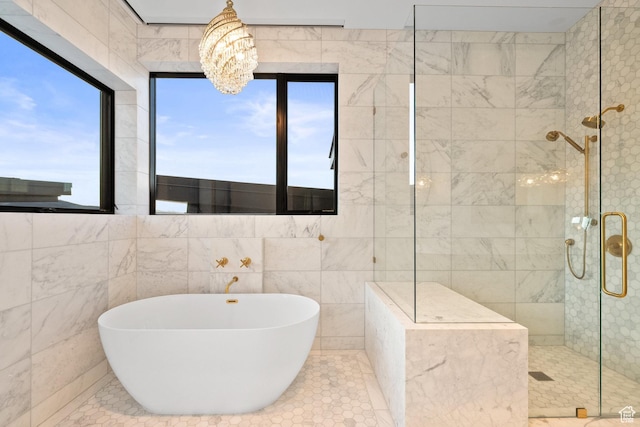27 Normans Way, Park City, UT 84060 - full bathroom featuring a soaking tub, a tile shower, a chandelier, and tile walls