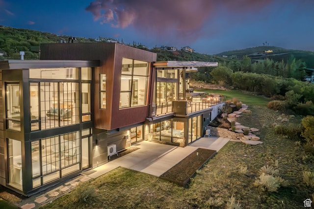 27 Normans Way, Park City, UT 84060 - back of property featuring a patio and a sunroom