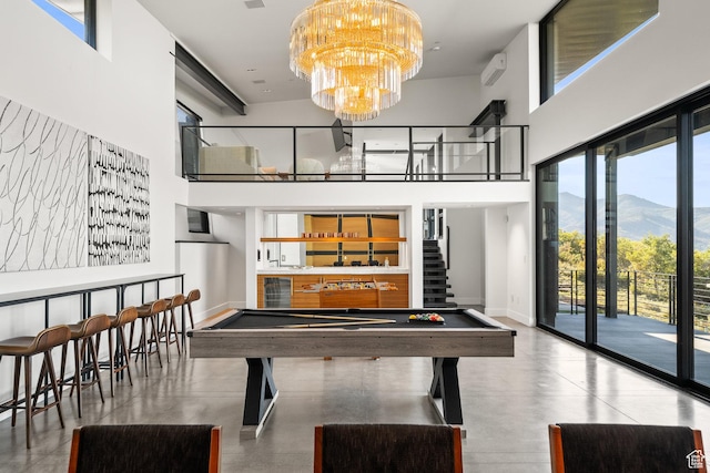 27 Normans Way, Park City, UT 84060 - playroom featuring a high ceiling, billiards, a mountain view, a community bar, and a chandelier