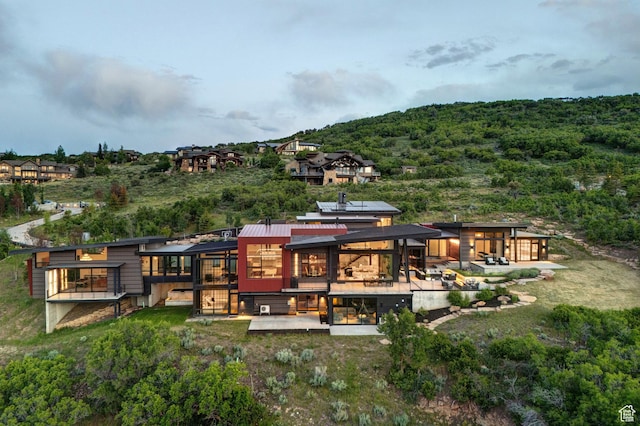 27 Normans Way, Park City, UT 84060 - back of house featuring a patio area, a forest view, and a wooden deck