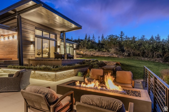 27 Normans Way, Park City, UT 84060 - patio terrace at dusk featuring an outdoor fire pit, a patio area, and a lawn