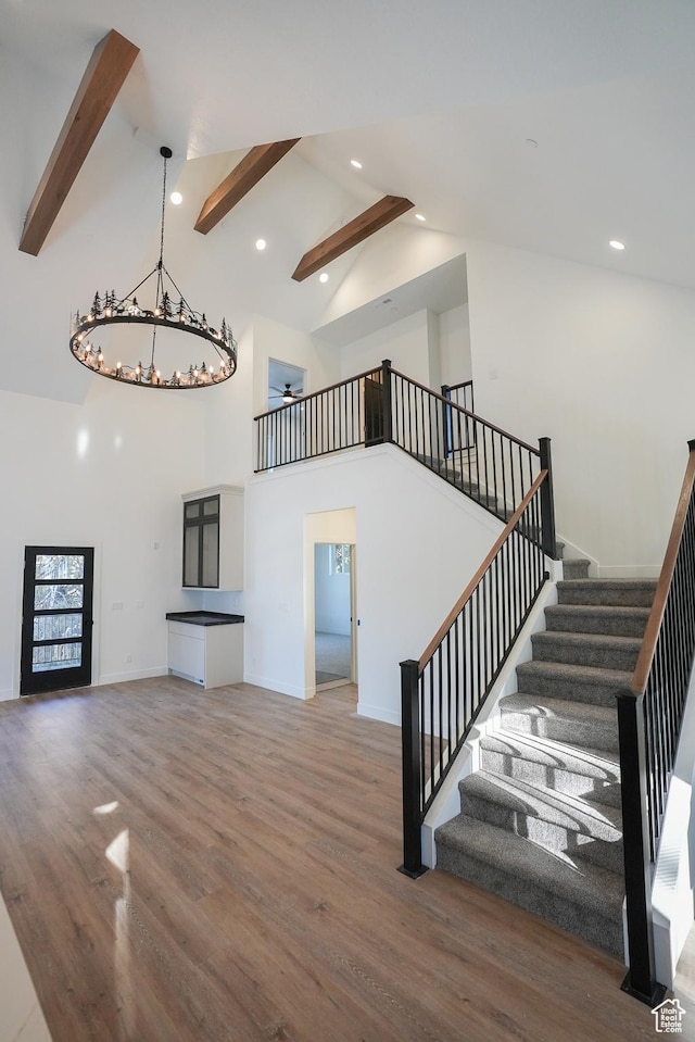 9542 Ridge Pine Rd, Heber City, UT 84032 - unfurnished living room with high vaulted ceiling, beam ceiling, and hardwood / wood-style floors