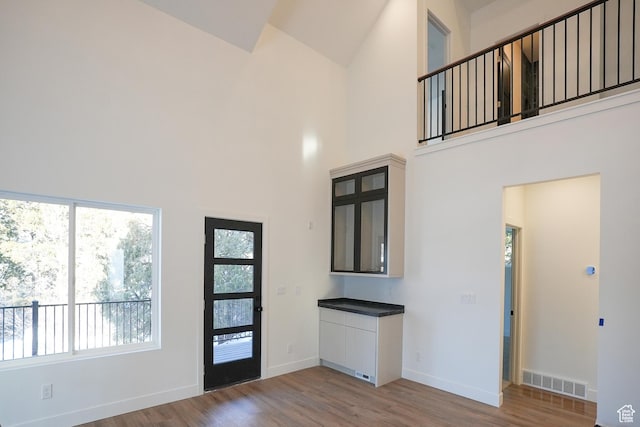 9542 Ridge Pine Rd, Heber City, UT 84032 - foyer entrance with a towering ceiling and hardwood / wood-style floors
