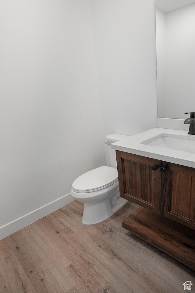 9542 Ridge Pine Rd, Heber City, UT 84032 - bathroom featuring vanity, hardwood / wood-style flooring, and toilet