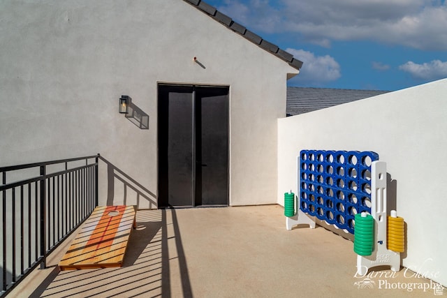 1460 S Windsor Pkwy Unit 5, Hurricane, UT 84737 - view of exterior entry with stucco siding and a balcony