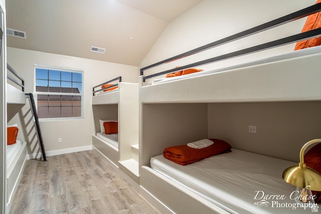 1460 S Windsor Pkwy Unit 5, Hurricane, UT 84737 - bedroom with baseboards, visible vents, wood finished floors, and vaulted ceiling