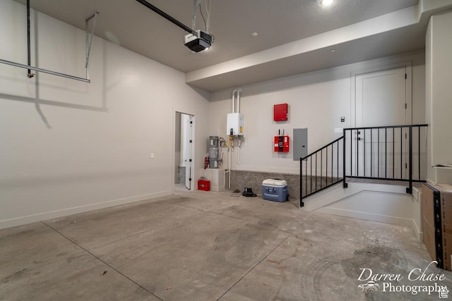 1460 S Windsor Pkwy Unit 5, Hurricane, UT 84737 - garage featuring electric panel, a garage door opener, and baseboards