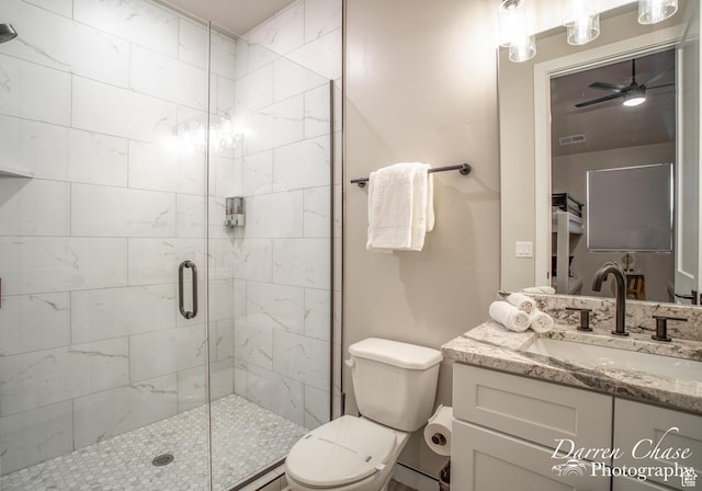 1460 S Windsor Pkwy Unit 5, Hurricane, UT 84737 - full bathroom featuring toilet, vanity, a shower stall, and a ceiling fan