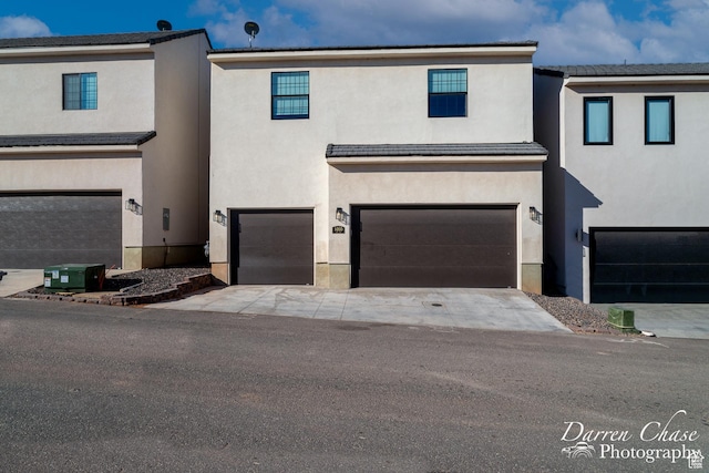 1460 S Windsor Pkwy Unit 5, Hurricane, UT 84737 - view of property featuring a garage and stucco siding