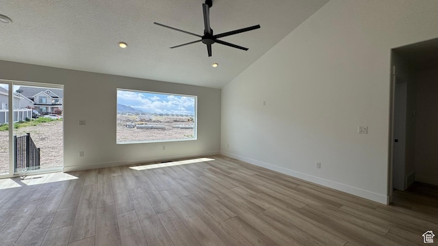 477 W 1860 N Unit 343, Tooele, UT 84074 - unfurnished living room featuring lofted ceiling, a ceiling fan, wood finished floors, and baseboards