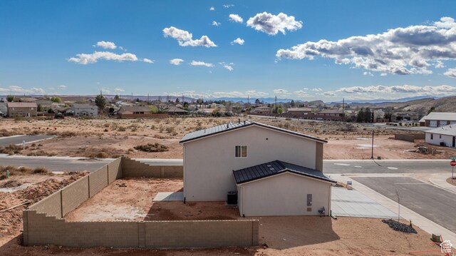3377 W Palomar, Hurricane, UT 84737 - exterior space featuring stucco siding, a mountain view, and fence