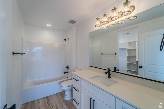3377 W Palomar, Hurricane, UT 84737 - full bathroom featuring vanity, wood finished floors, visible vents, shower / tub combination, and toilet