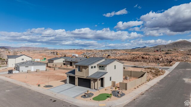 3377 W Palomar, Hurricane, UT 84737 - view of front facade with fence, stucco siding, a garage, a tile roof, and a mountain view